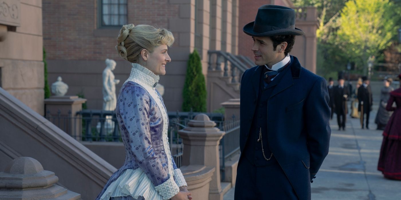 Louisa Jacobson and Harry Richardson standing on the street together in The Gilded Age Season 2