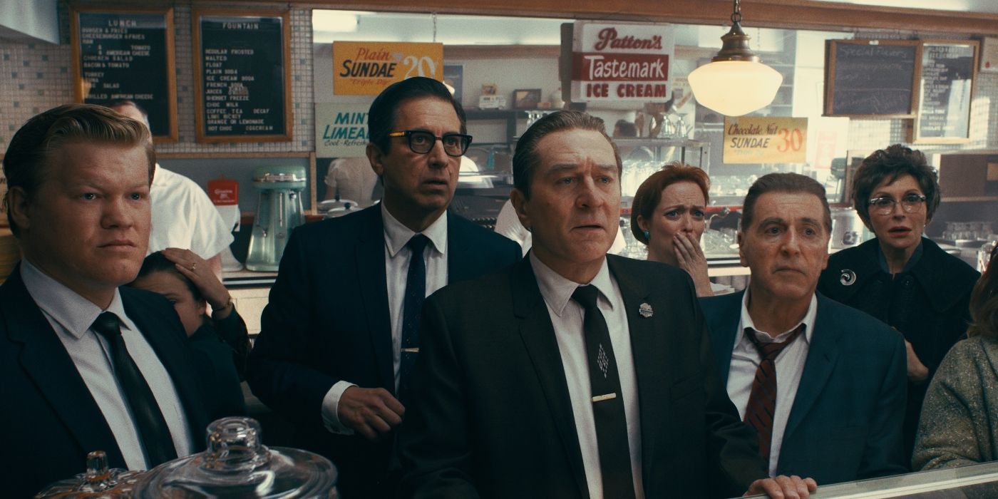 A group of men at a butcher's store looking ahead in The Irishman