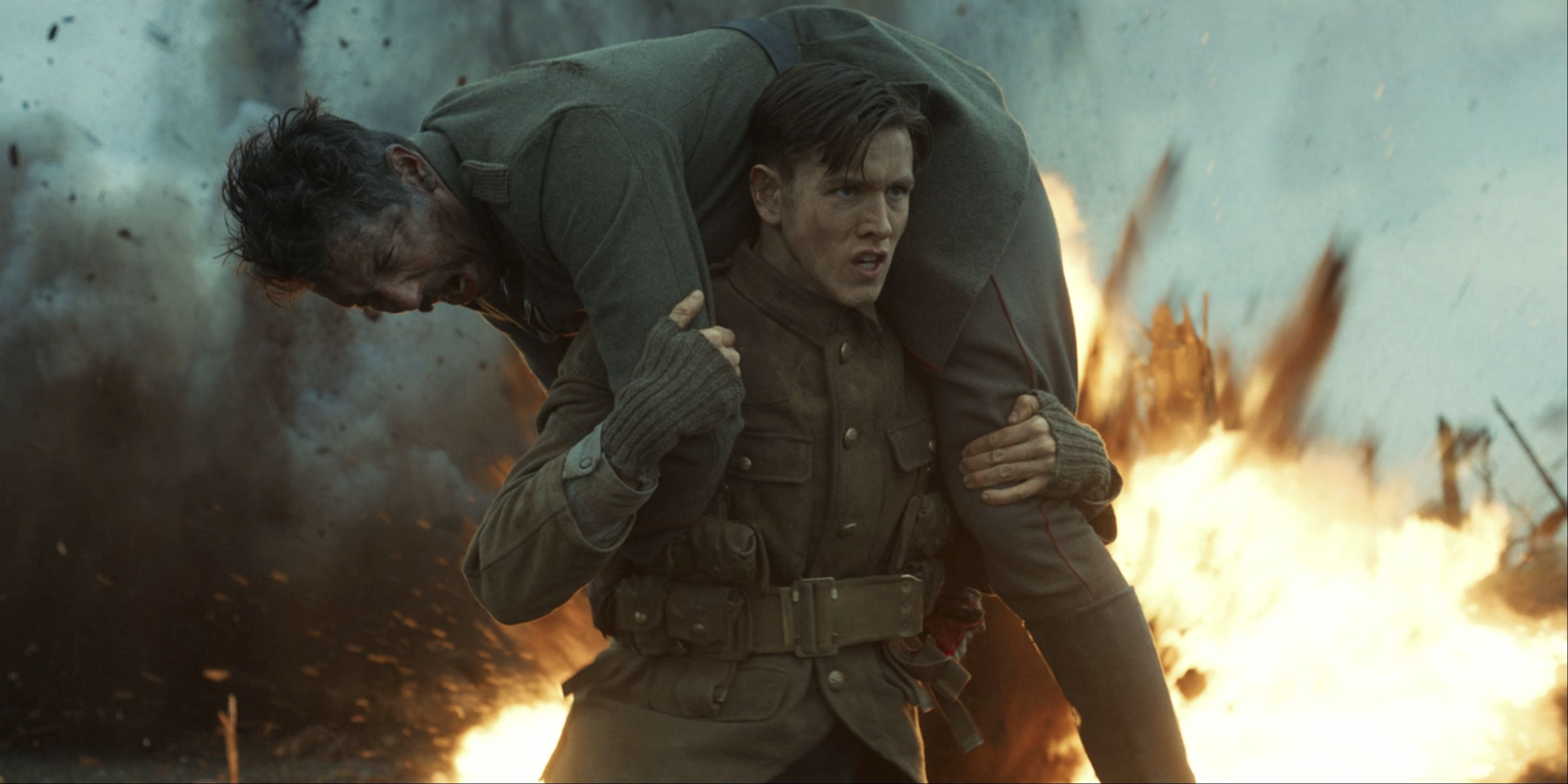 Harris Dickinson carrying soldier in The King's Man