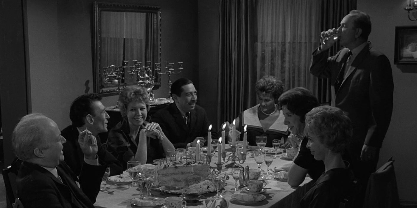 Black and white image of people having a dinner party in The Twilight Zone