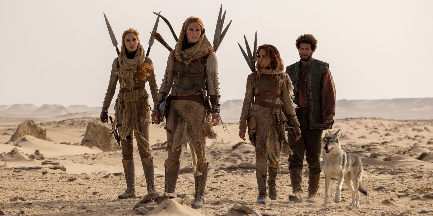 Marcus Rutherford, Ayoola Smart, Ragga Ragnars & Maja Simonsen walking in a desert in Wheel of Time Season 2