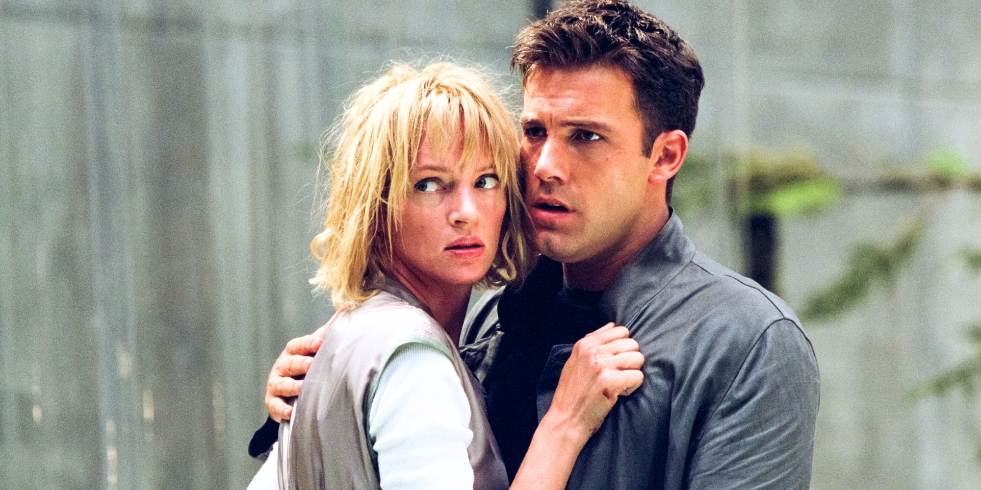 Uma Thurman and Ben Affleck holding each other close in Paycheck (2003)