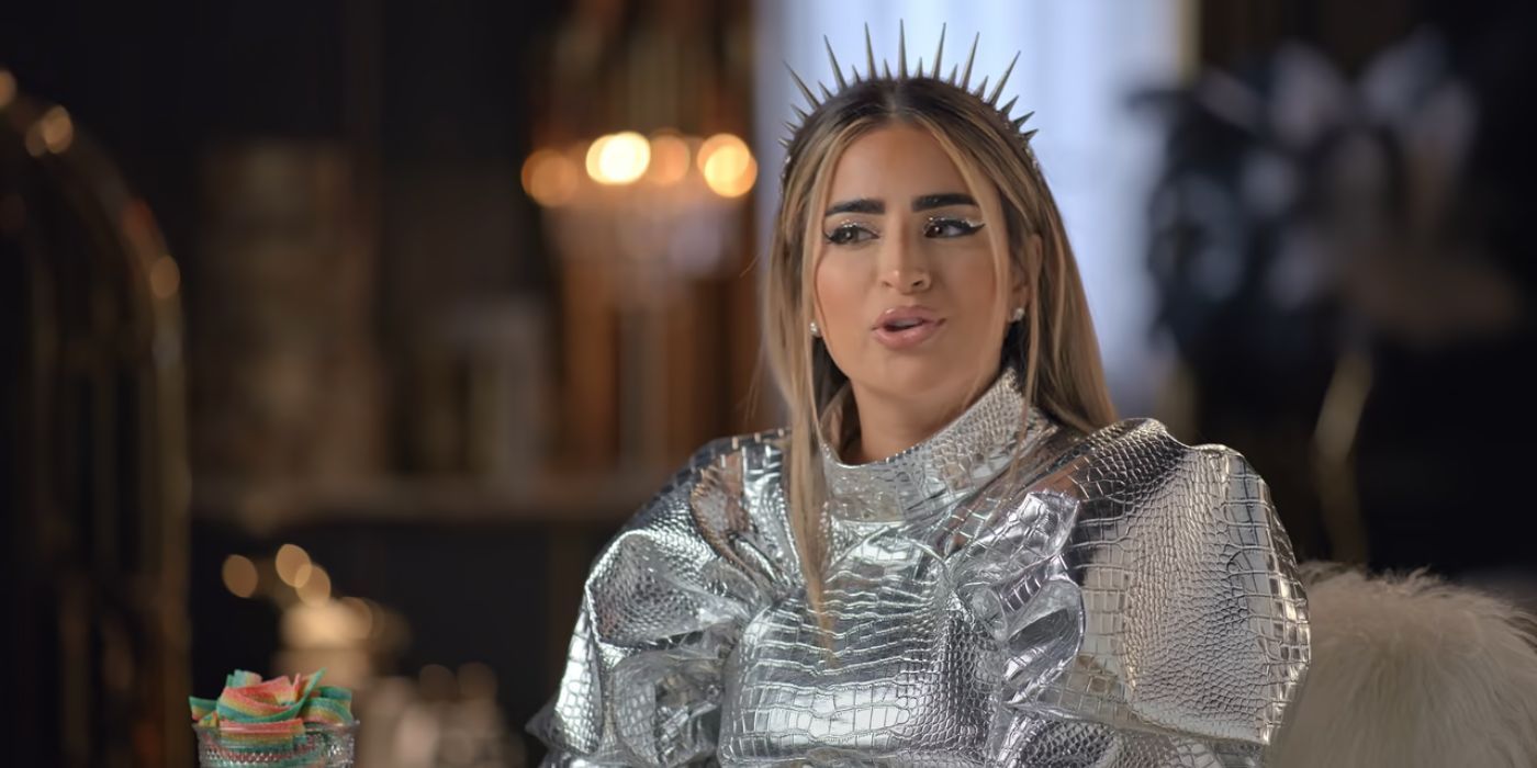 Dubai Bling cast member Safa Siddiqui wearing a silver outfit in an aside interview.