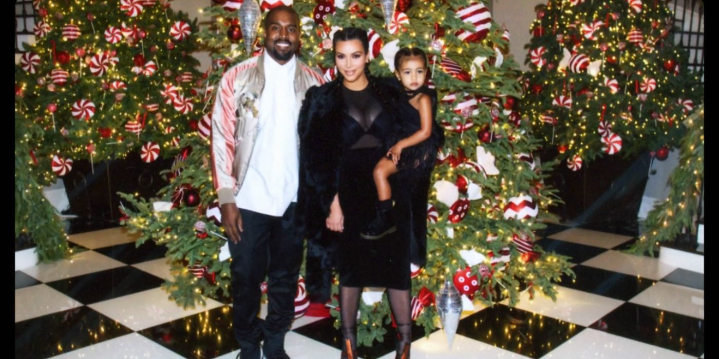Kanye West and Kim Kardashian pose with a young North West at Kris Jenner&rsquo;s Christmas Party Keeping Up With The Kardashians