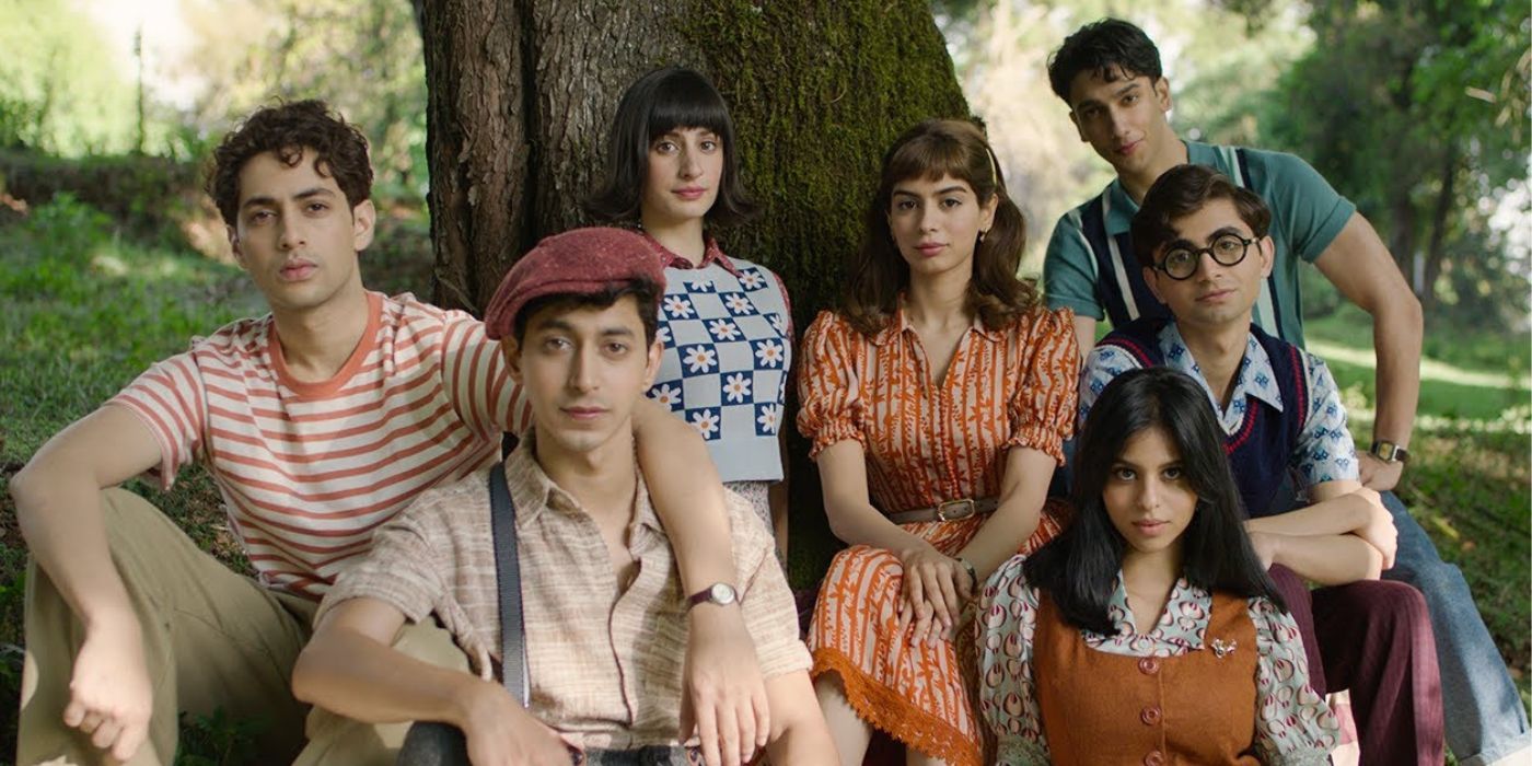 Khushi Kapoor, Suhana Khan, Vedang Raina, and Agastya Nanda sitting in front of a tree in a promotional image for The Archies (2023)