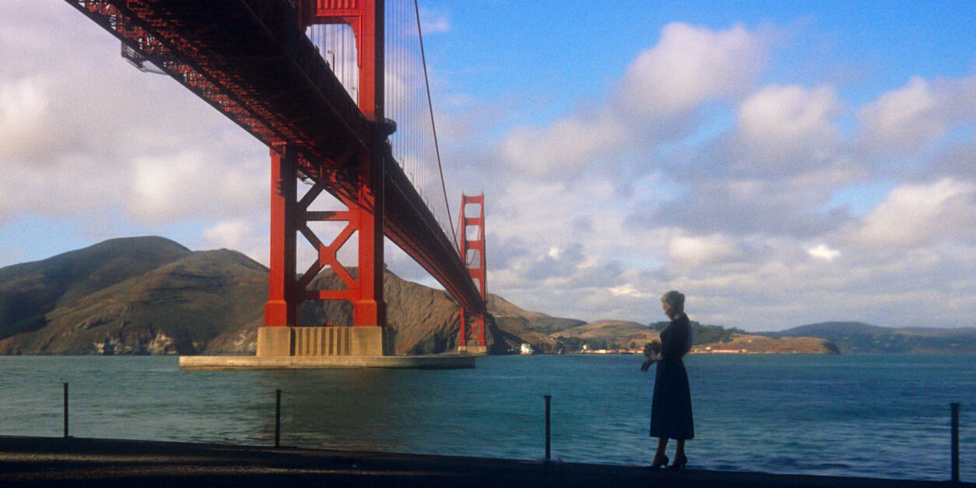 Kim Novak standing under a bridge in Alfred Hitchcock's Vertigo