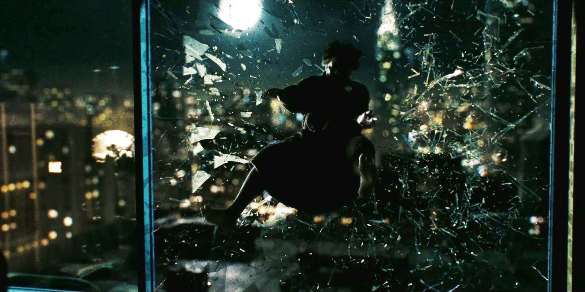 The Comedian (Jeffrey Dean Morgan) being thrown out a window in 'Watchmen.'