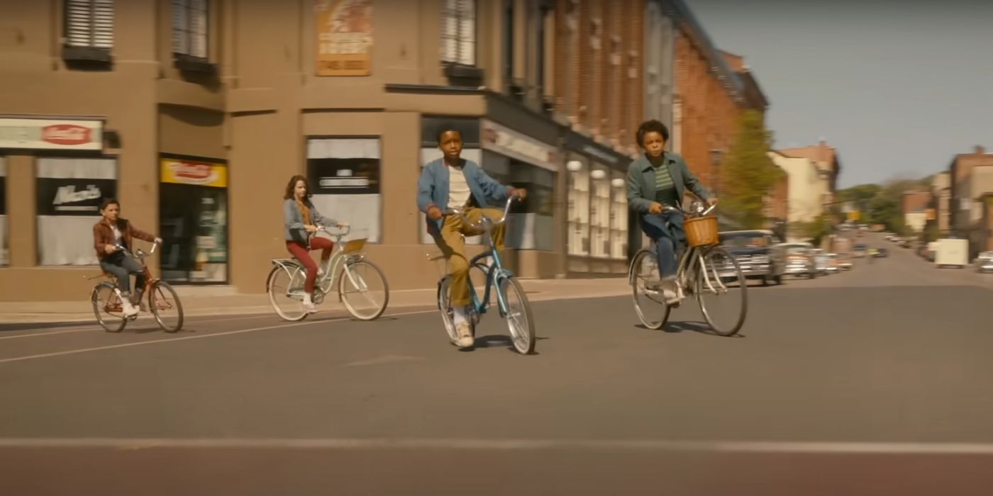 Four kids riding their bikes through the streets in Welcome to Derry