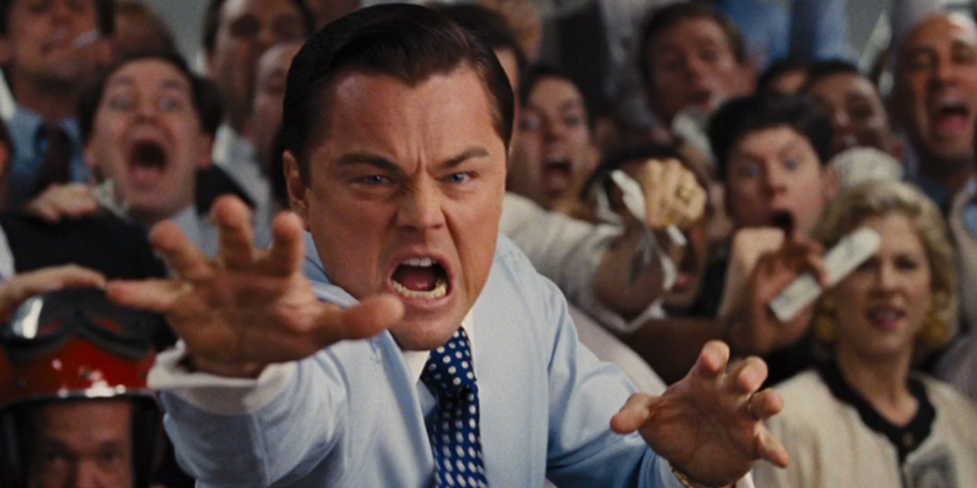 Leonardo DiCaprio as Jordan Belfort, angrily reaching for the camera in The Wolf of Wall Street