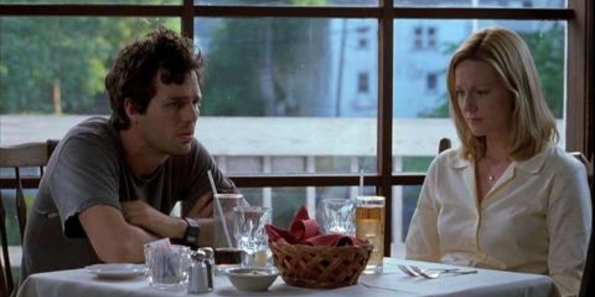 Mark Ruffalo as Terry Prescott and Laura Linney as Samantha sitting at a table in You Can Count On Me