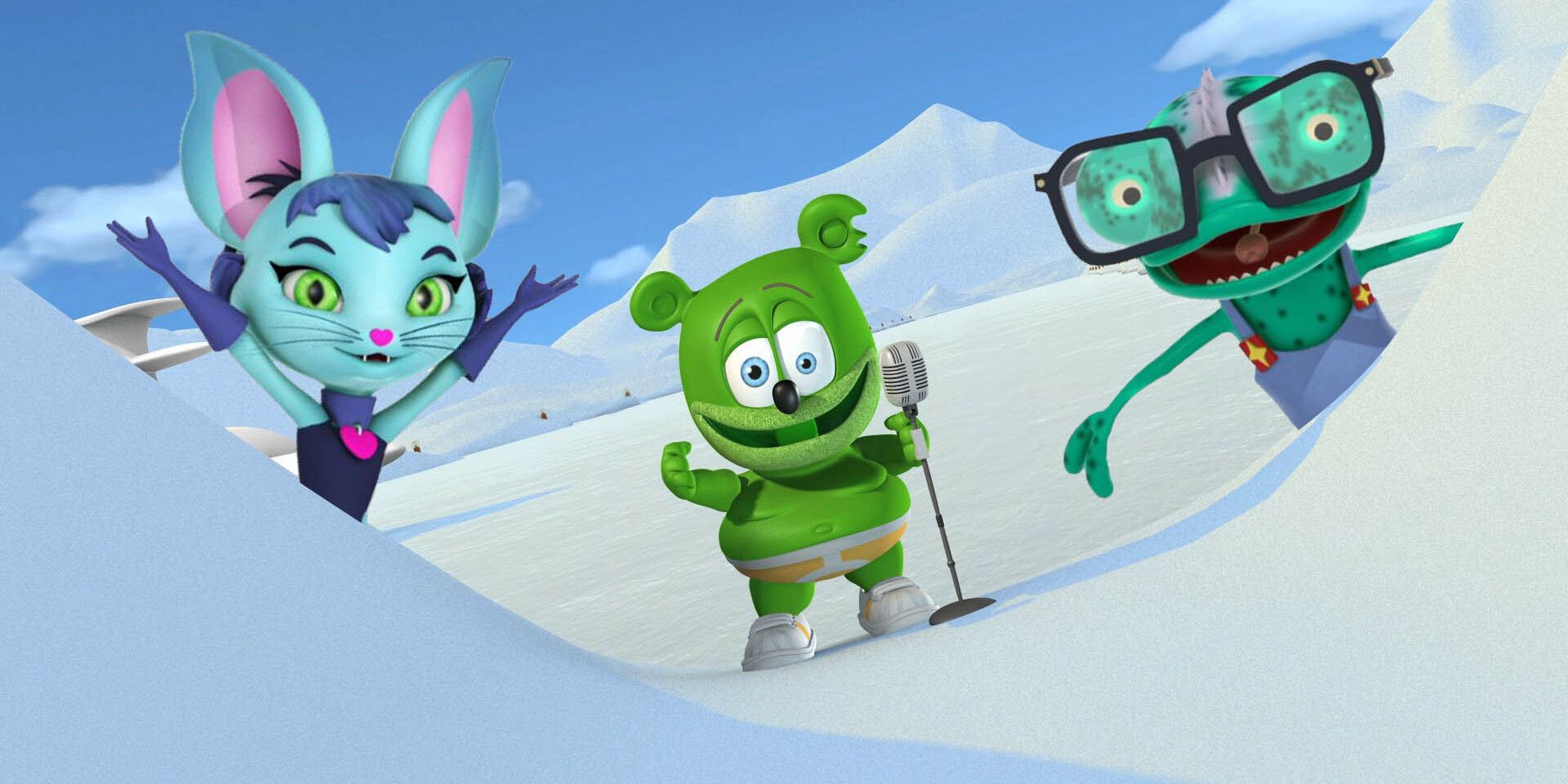 A green gummy bear singing in the arctic with his animal friends in The Yummy Gummy Search for Santa