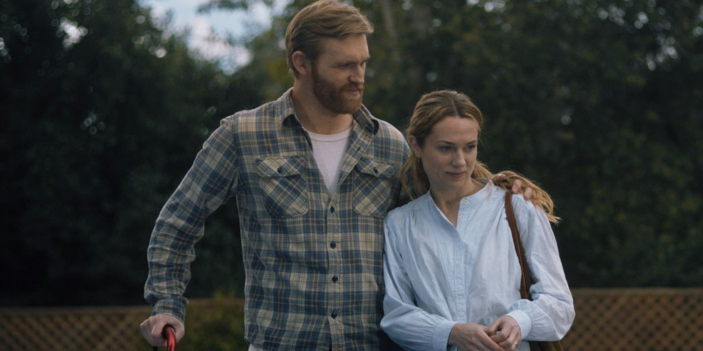 Wyatt Russell as Ray Waller and Kerry Condon as Eve Waller standing together in Night Swim