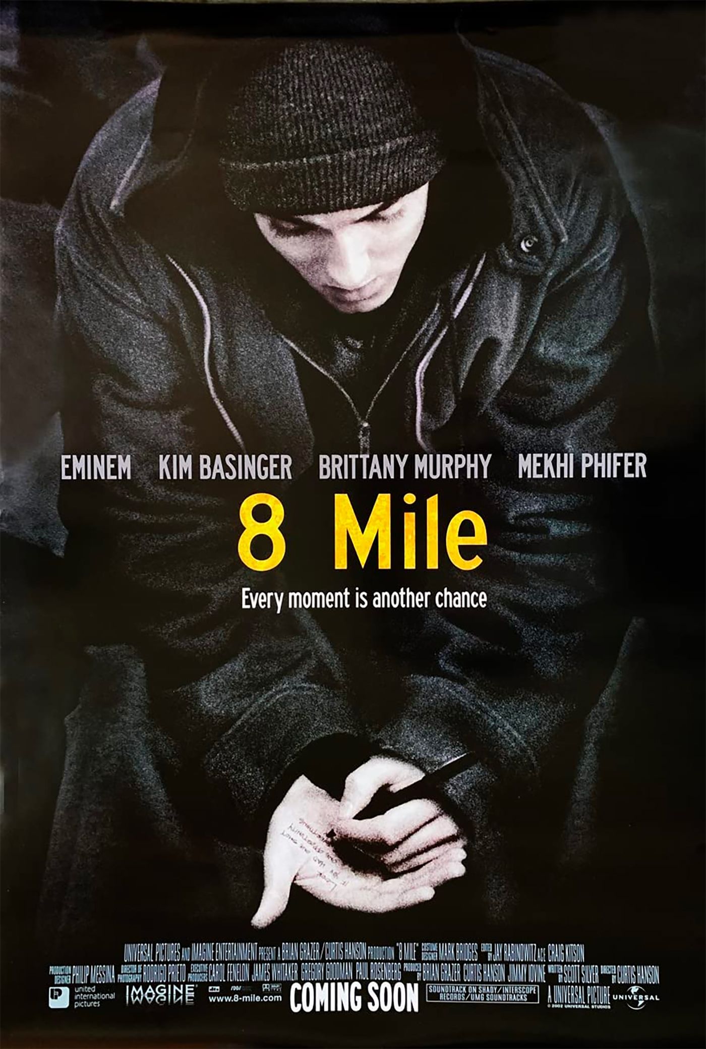 Eminem writing on his hand in the poster for 8 Mile