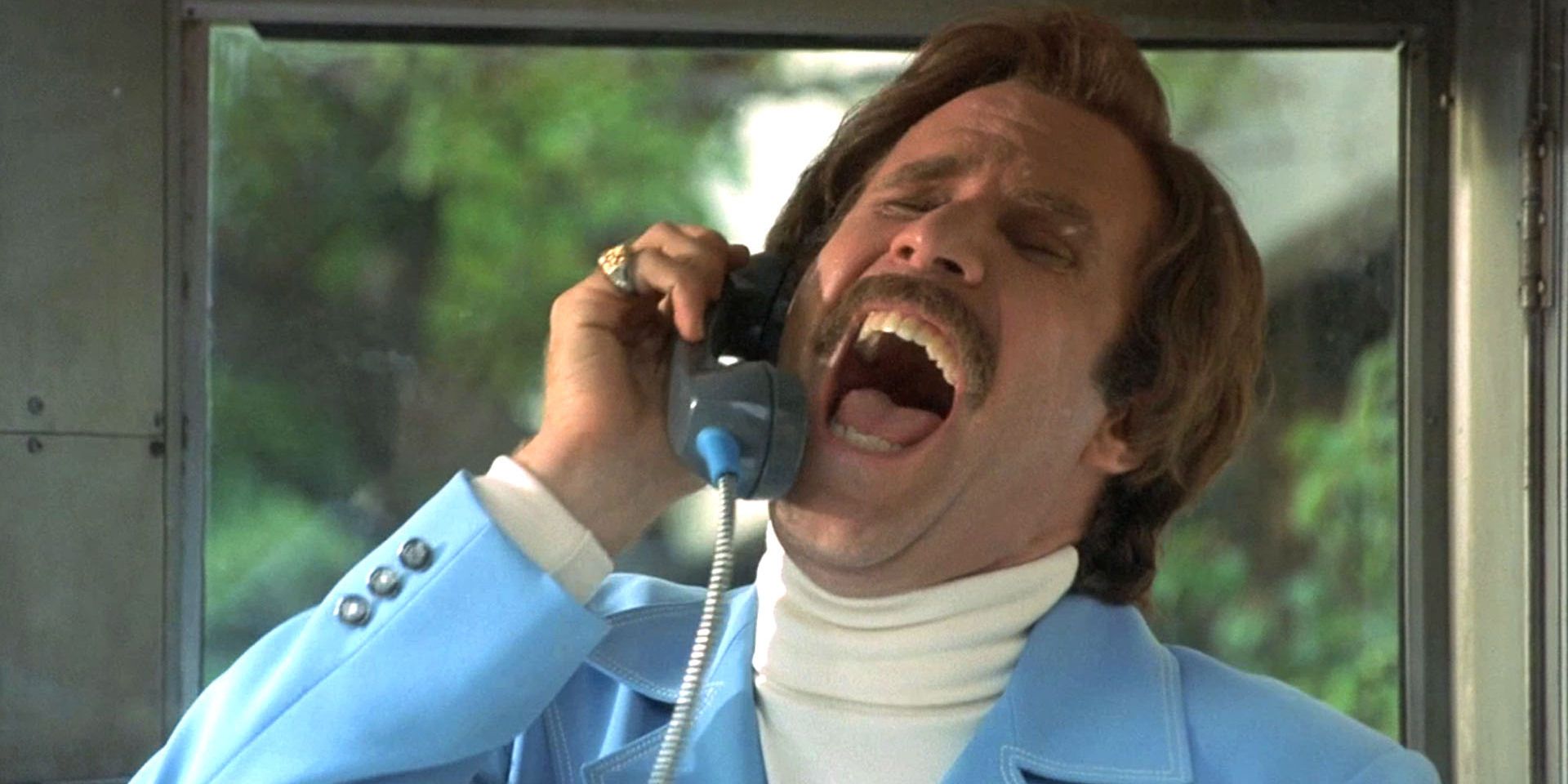 A still from the film Anchorman featuring Will Ferrell as Ron Burgundy yelling into the telephone of a payphone