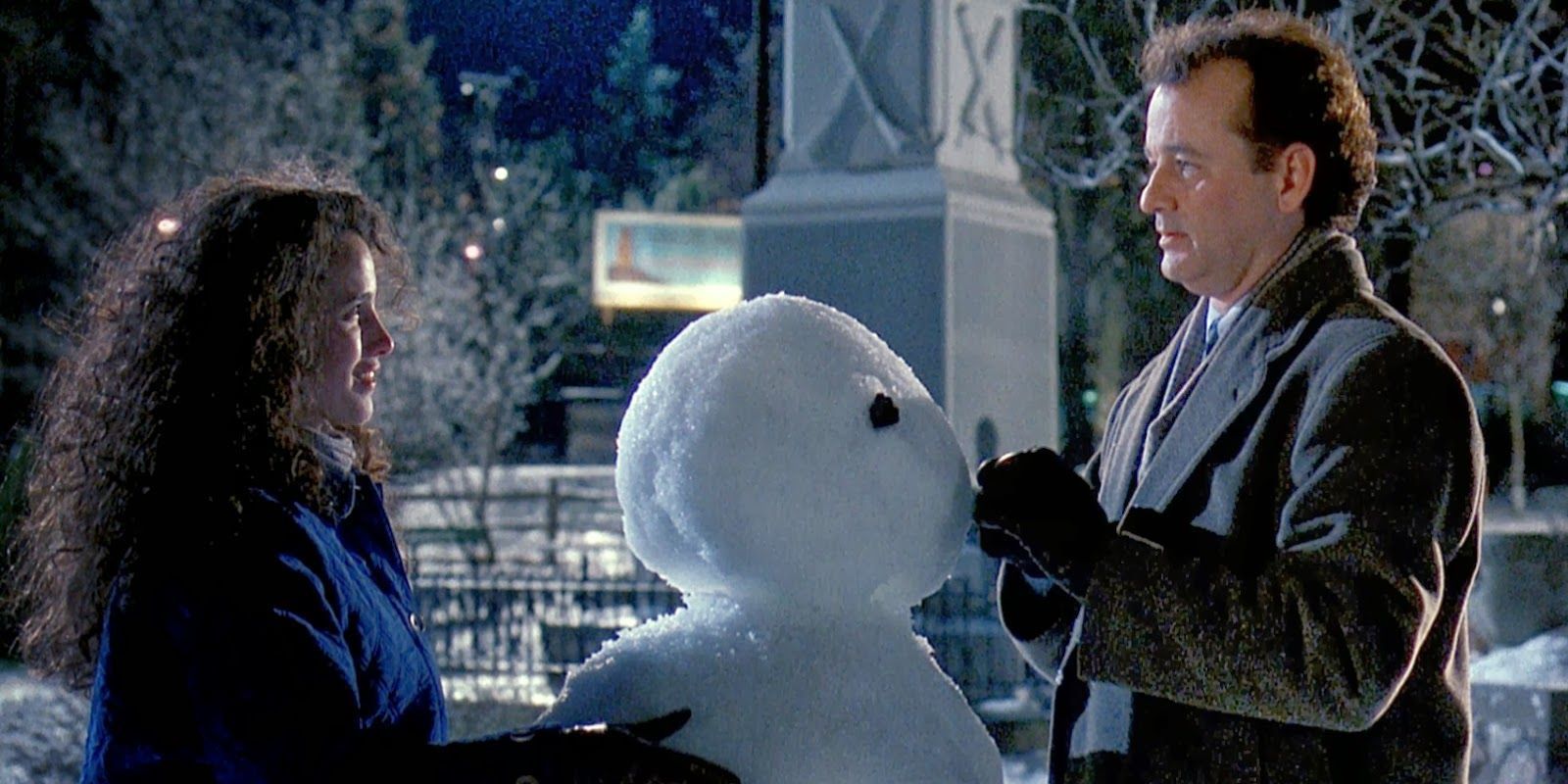 Rita (Andie MacDowell) and Phil Connors (Bill Murray) build a snowman in Groundhog Day