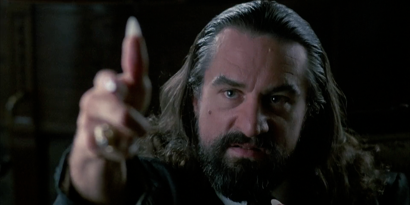 Louise Cypher (Robert de Niro) pointing towards the camera in Angel Heart