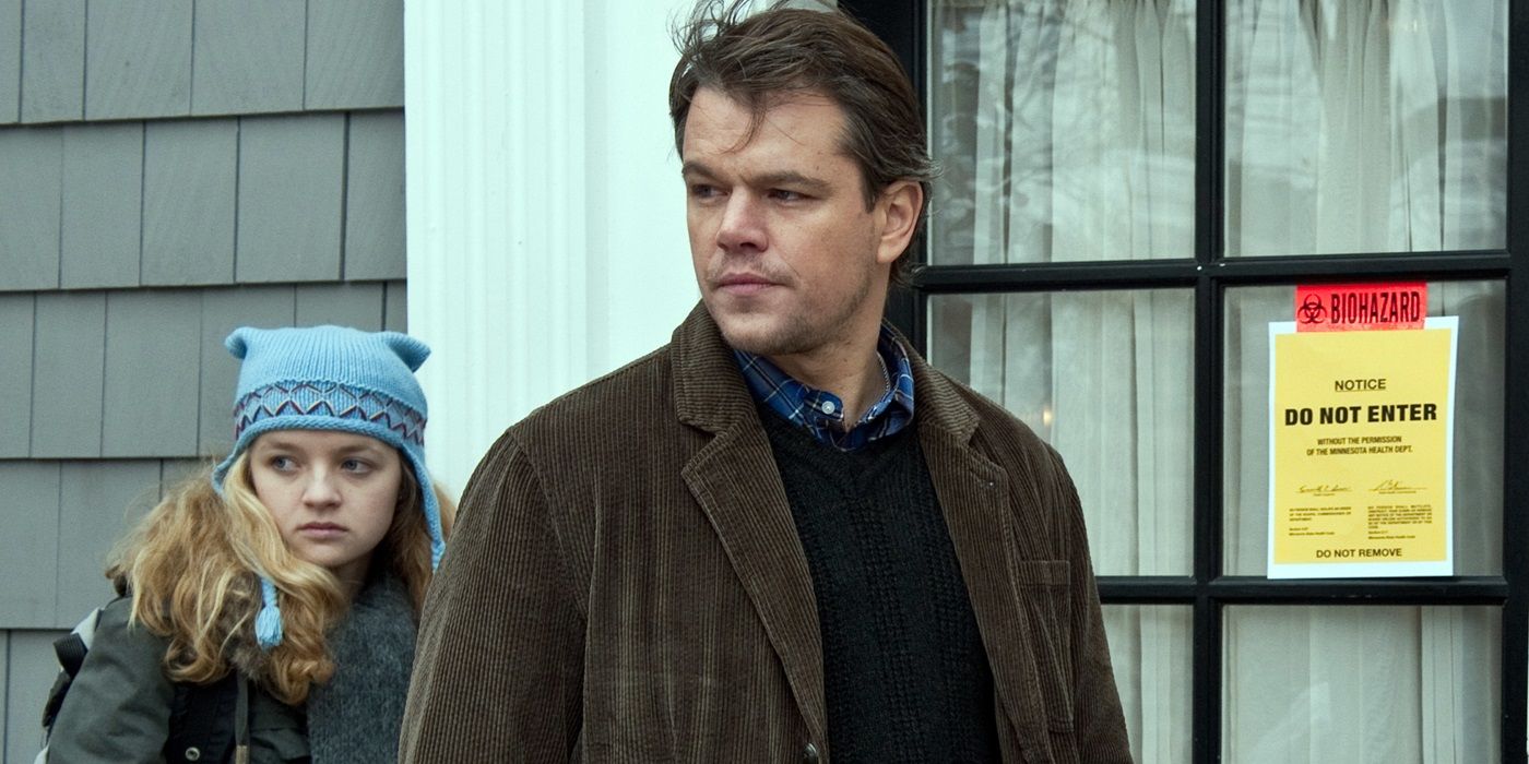 Anna Jacoby-Heron as Jory Emhoff and Matt Damon as Mitch Emhoff looking back at a person offscreen in Contagion