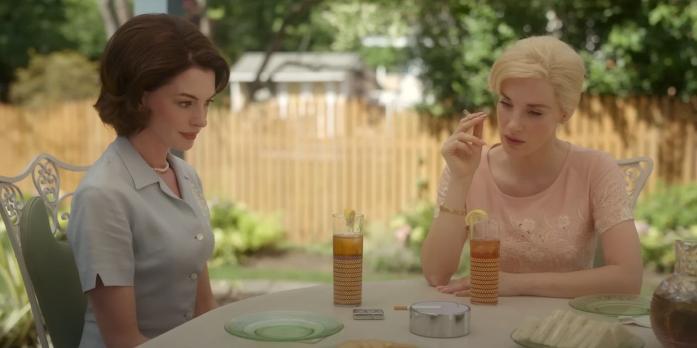Anne Hathaway as Céline and Jessica Chastain as Alice sitting at a table in Mothers' Instinct