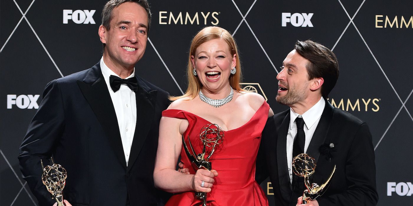 Matthew Macfadyen, Sarah Snook, and Kieran Culkin holding their awards while laughing in a group photo at the 2024 Emmys.