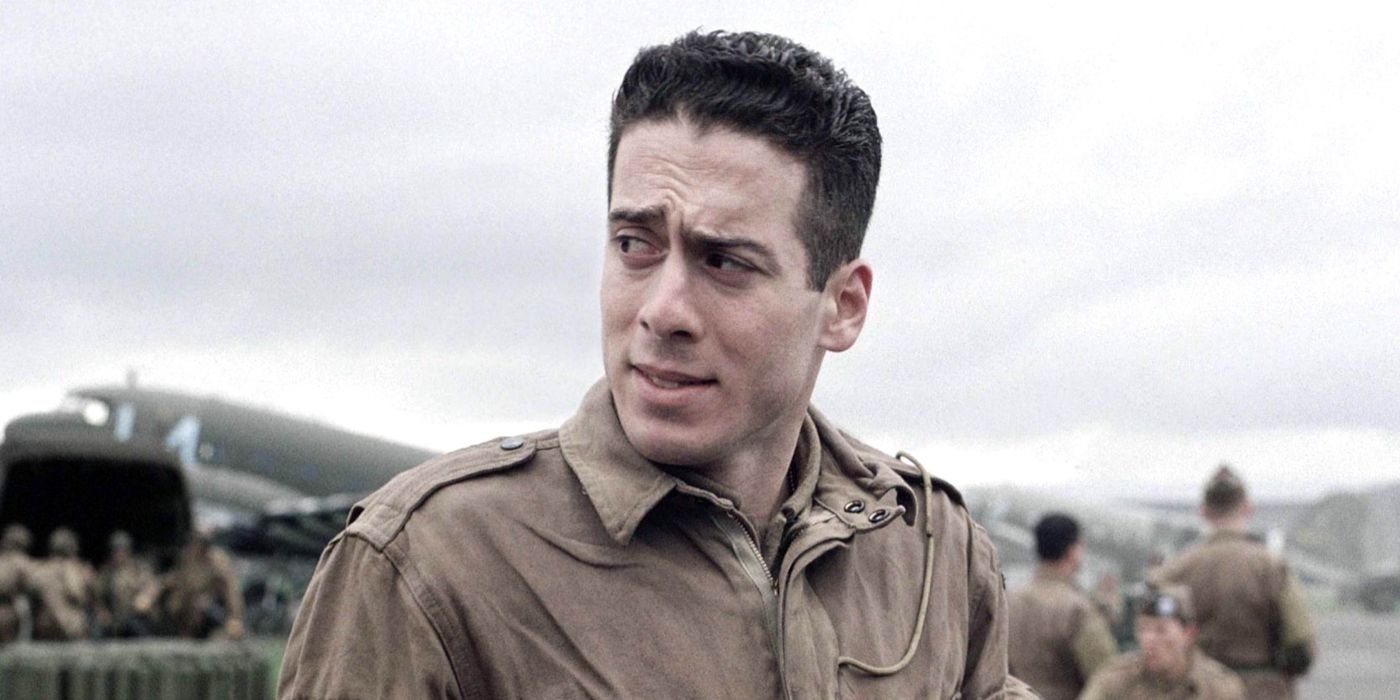 Kirk Acevedo as Joseph D. Toye, standing outside looking worried in Band of Brothers