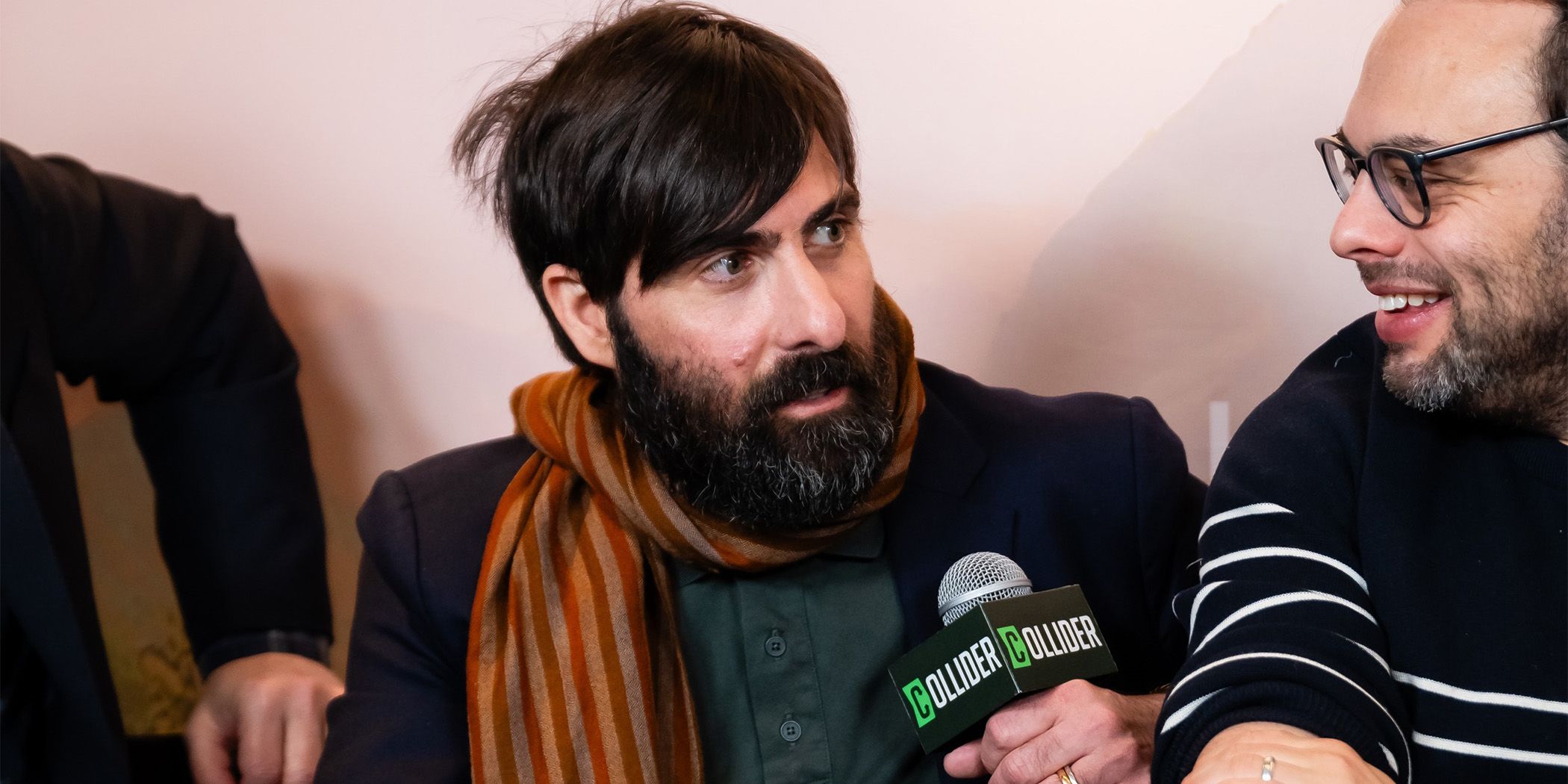 Between the Temples star Jason Schwartzman (center) talking and Nathan Silver (right) smiling in an interview at Sundance 2024