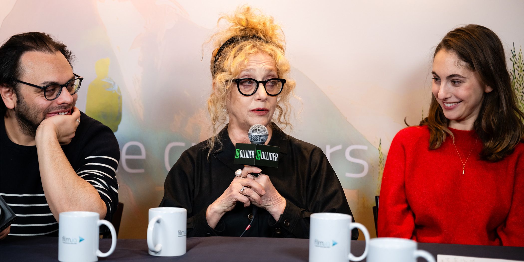 Nathan Silver (left) listening as Carole Kane (center) talks and Madeleine Weinstein (left) smiles during an interview for Between the Temples at Sundance 2024