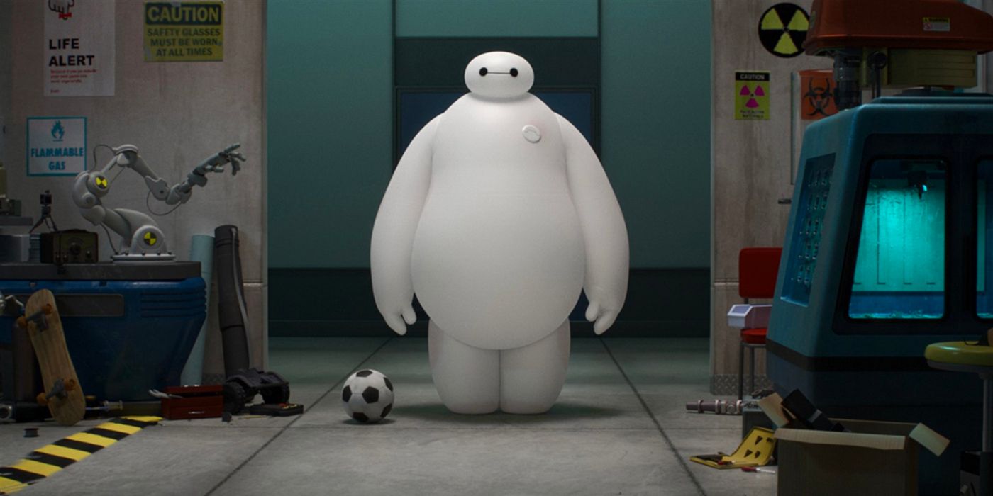 A large inflatable robot stands in the doorway of a scientific lab next to a soccer ball.