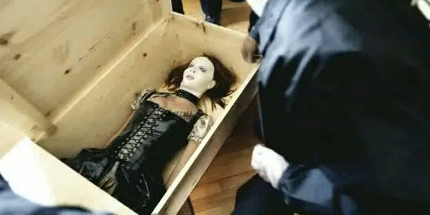 Cheryl's (Stacy Chbosky) body in a box in 'The Poughkeepsie Tapes'