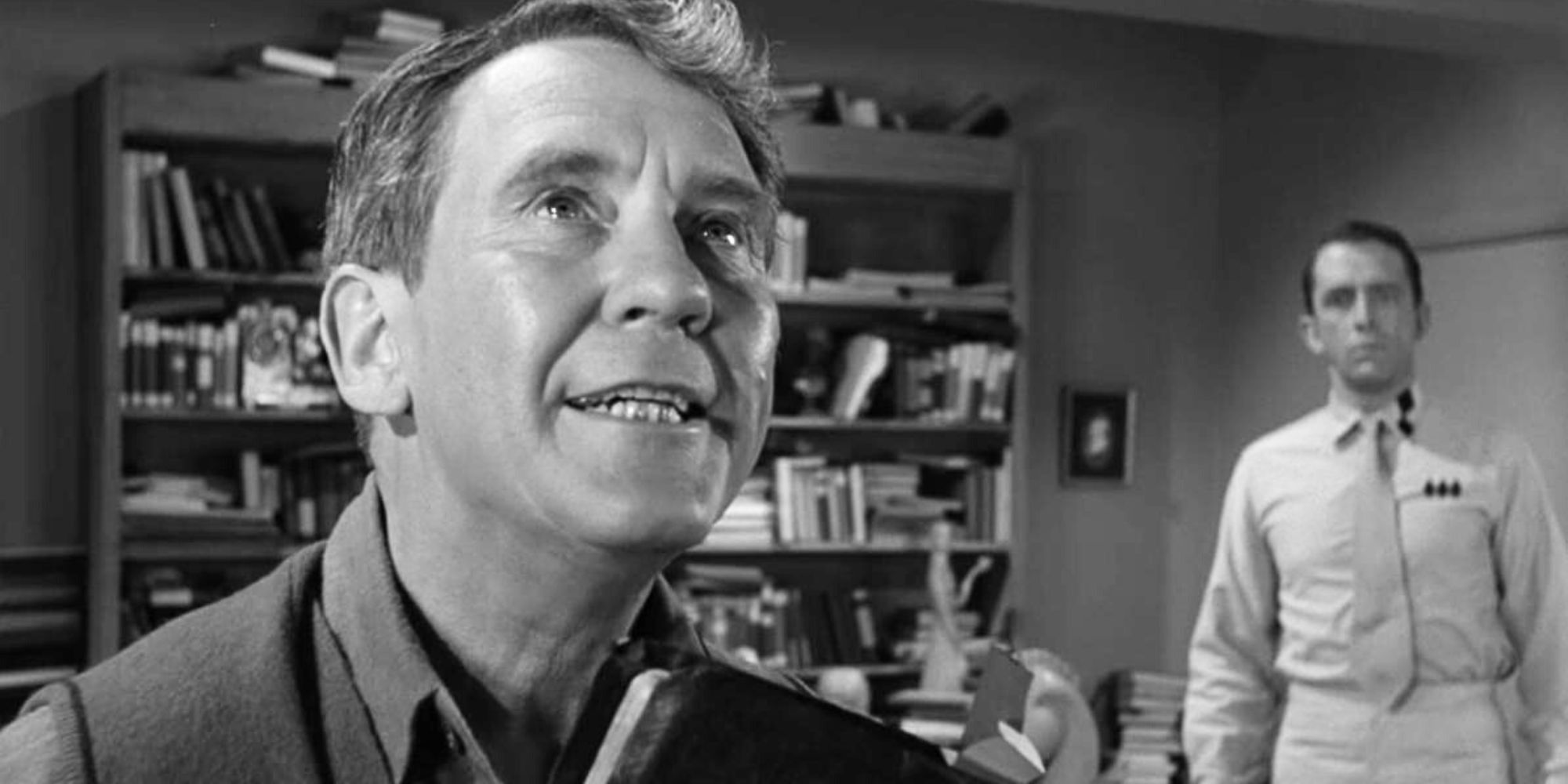 Burgess Meredith speaking while Fritz Weaver stands in the background in The Twilight Zone