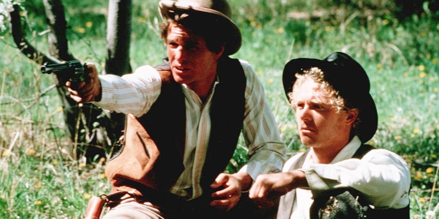 Butch Cassidy (Tom Berenger) and the Sundance Kid (William Kitt) in the grass in 'Butch and Sundance: The Early Days'