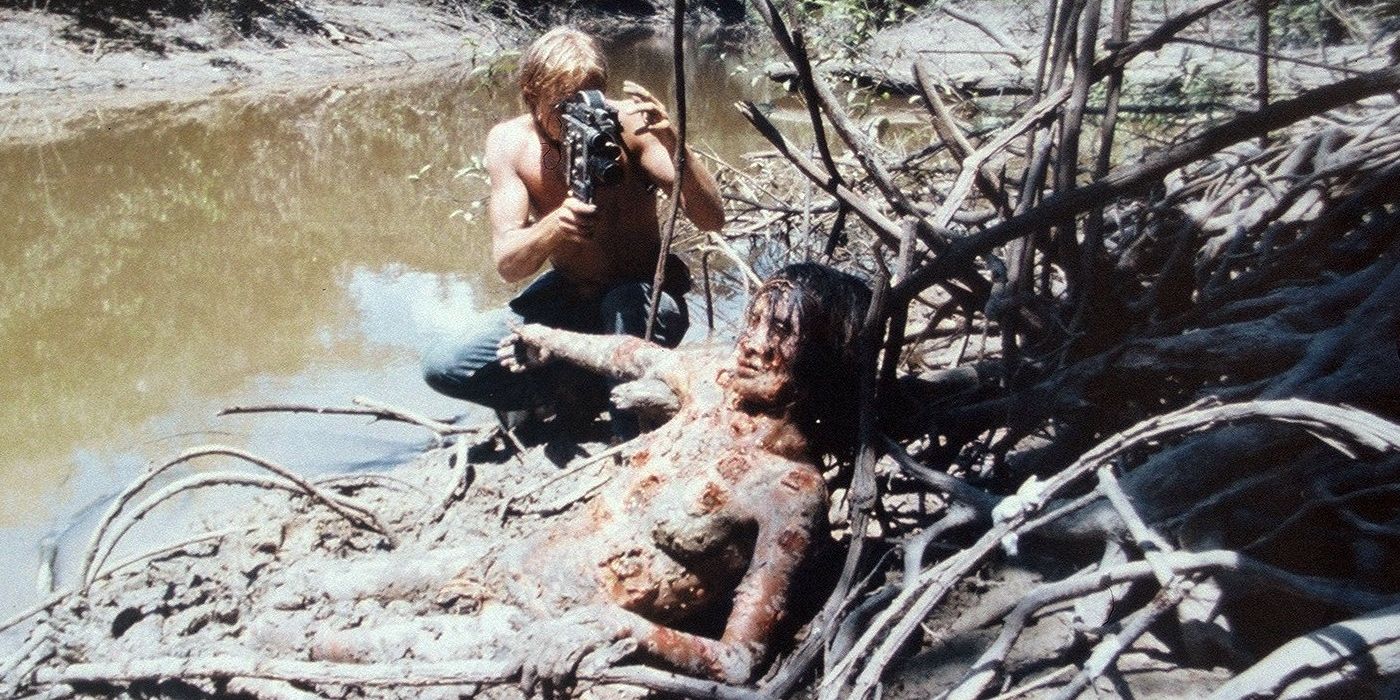 Perry Pirkanen as Jack Anders, filming a dead body in Cannibal Holocaust