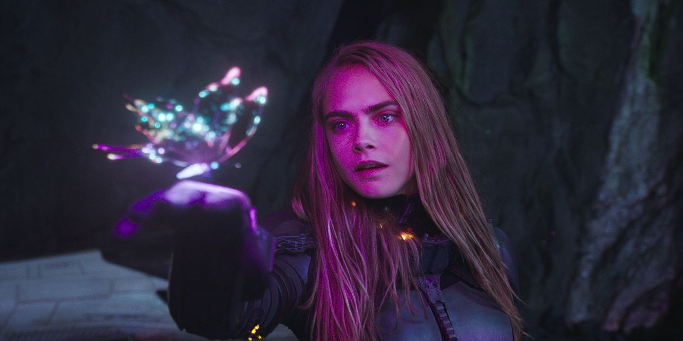 Cara Delevingne as Laureline, holding a light-based butterfly on her hand in Valerian and the City of a Thousand Planets