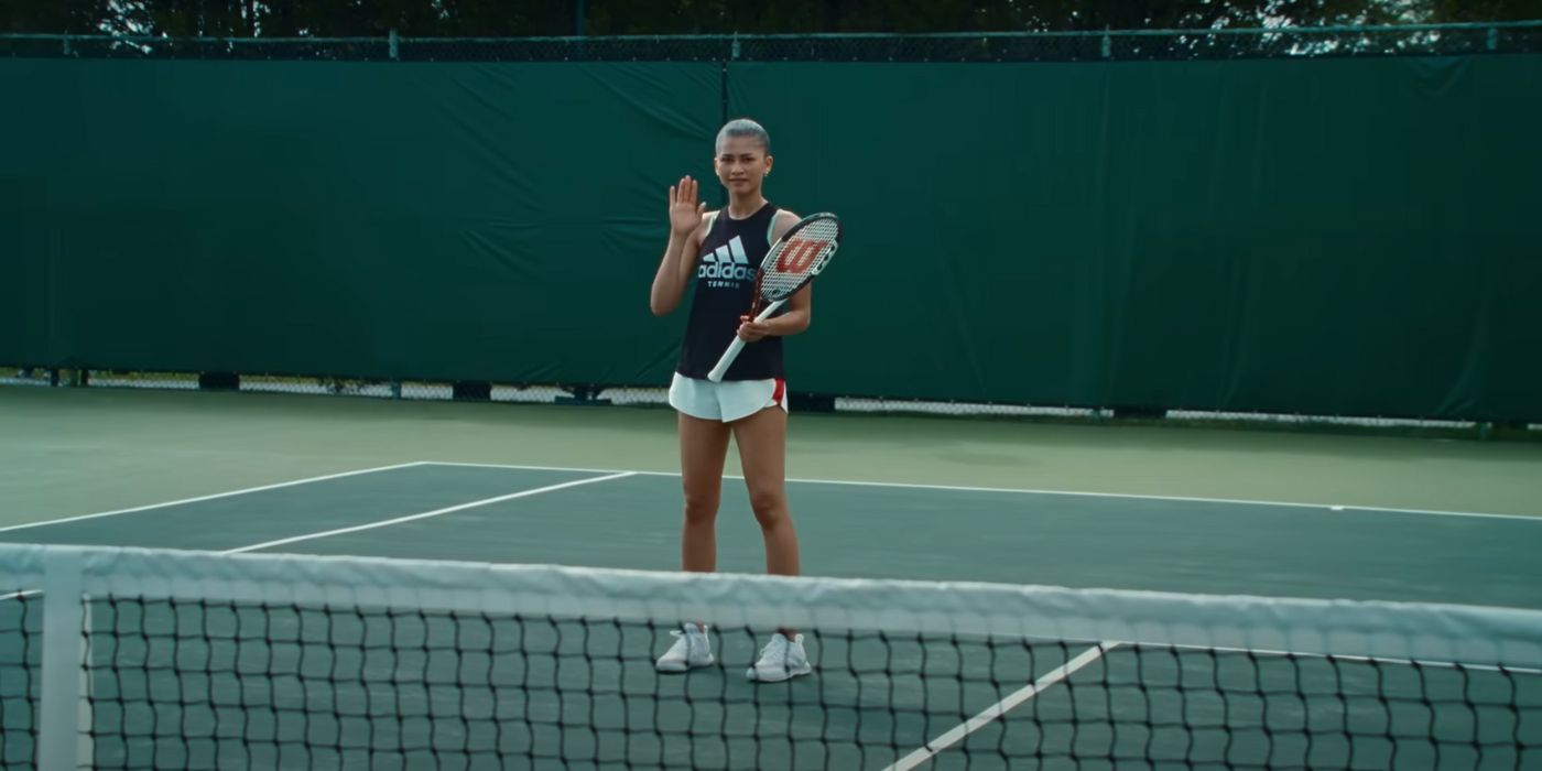 Tashi Duncan (Zendaya) waving while on a tennis court in Challengers