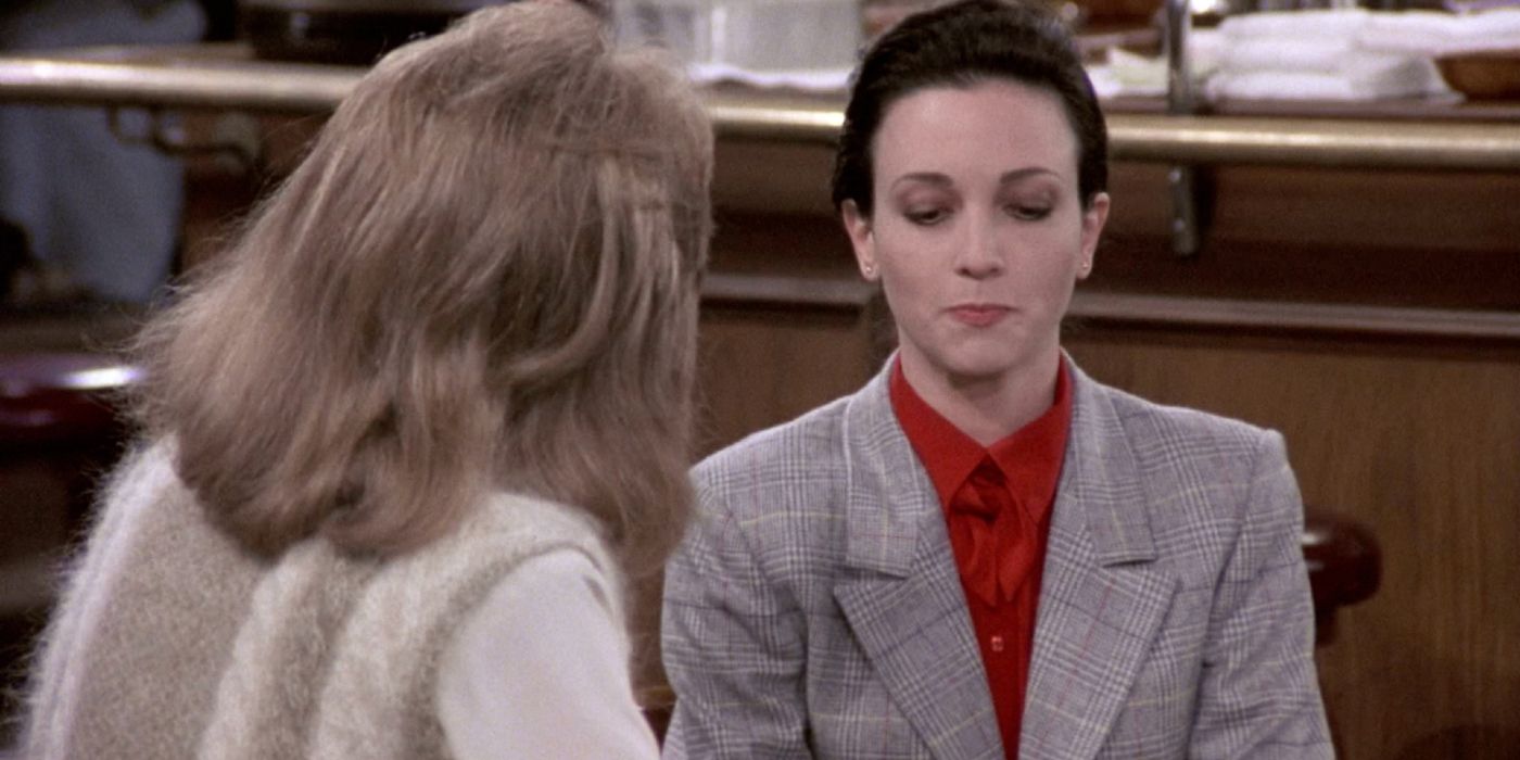 Bebe Neuwirth talking to a woman in Cheers