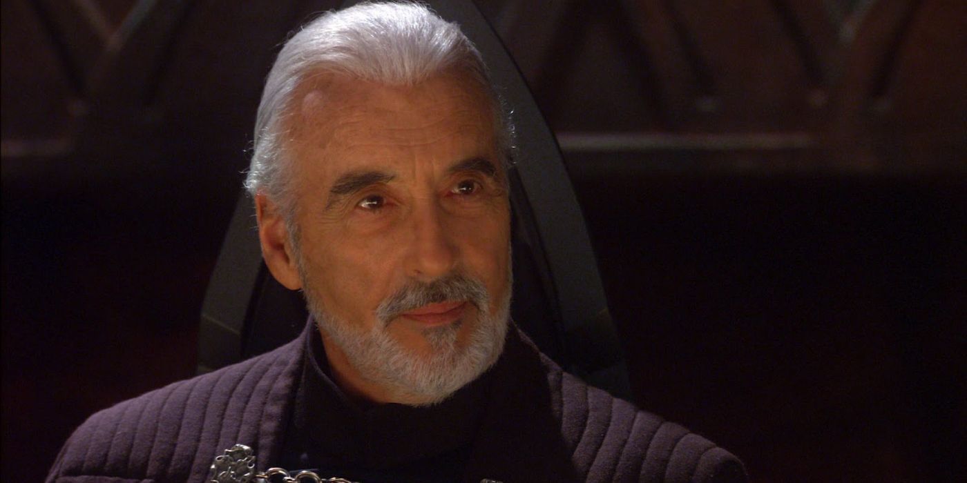 close-up of Dooku smirking while sitting in a chair in Star Wars