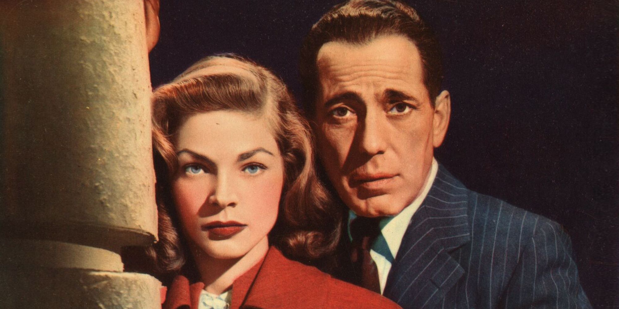 Humphrey Bogart and Lauren Bacall looking at the camera in a poster for Dark Passage