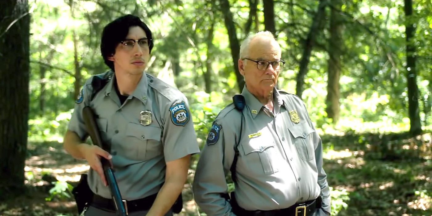 Adam Driver and Bill Murray as cops standing in the woods in The Dead Don't Die