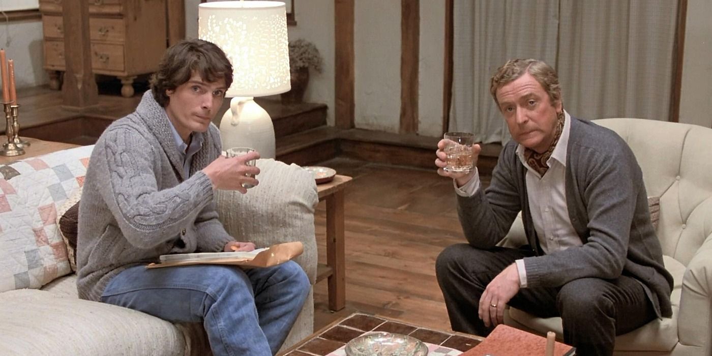 Michael Caine as Sidney and Christopher Reeve as Clifford sitting and drinking in Deathtrap