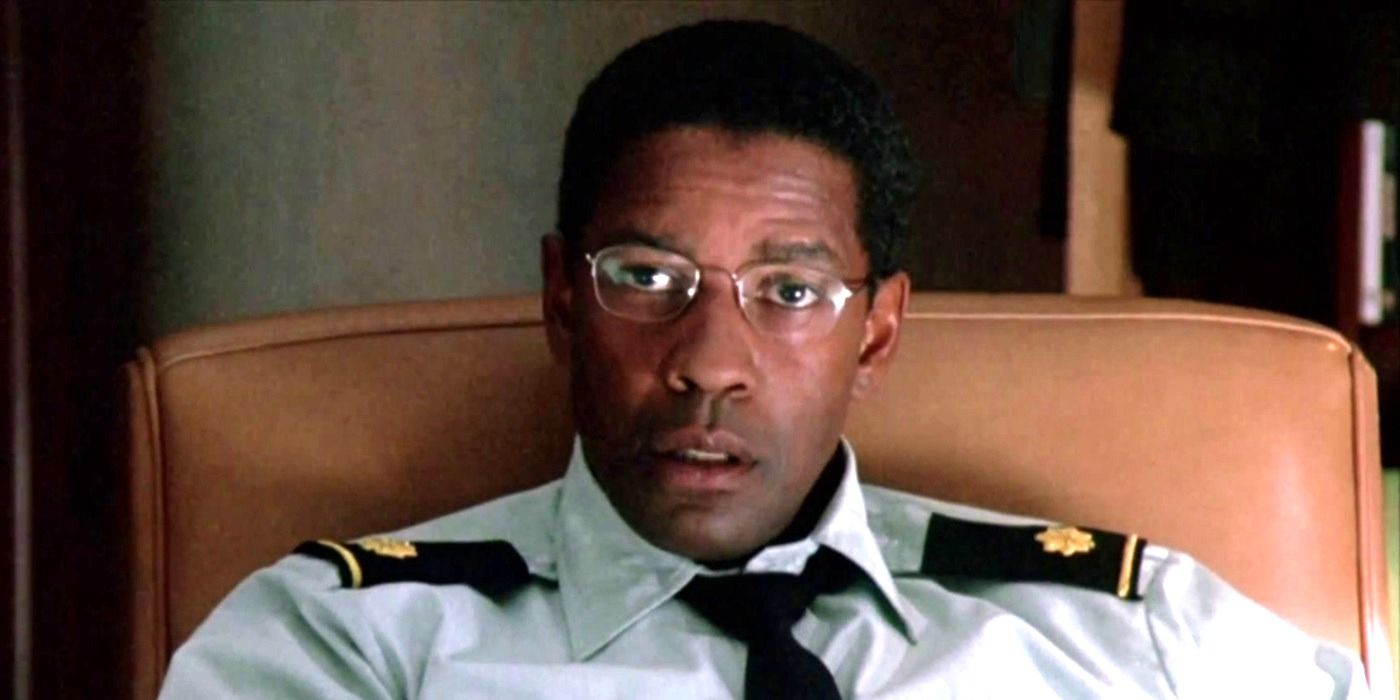 Denzel Washington as Major Bennett Marco sitting in a chair in 2004's The Manchurian Candidate