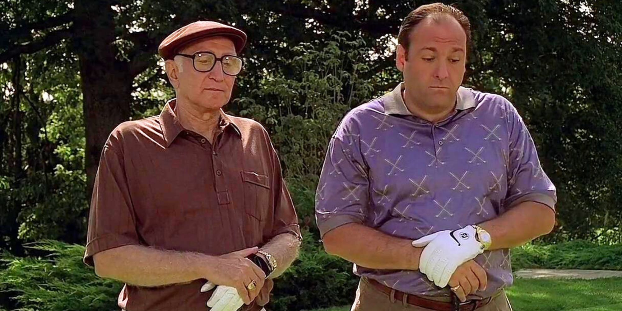 Dominic Chianese and James Gandolfini standing next to each other one a golf course in The Sopranos