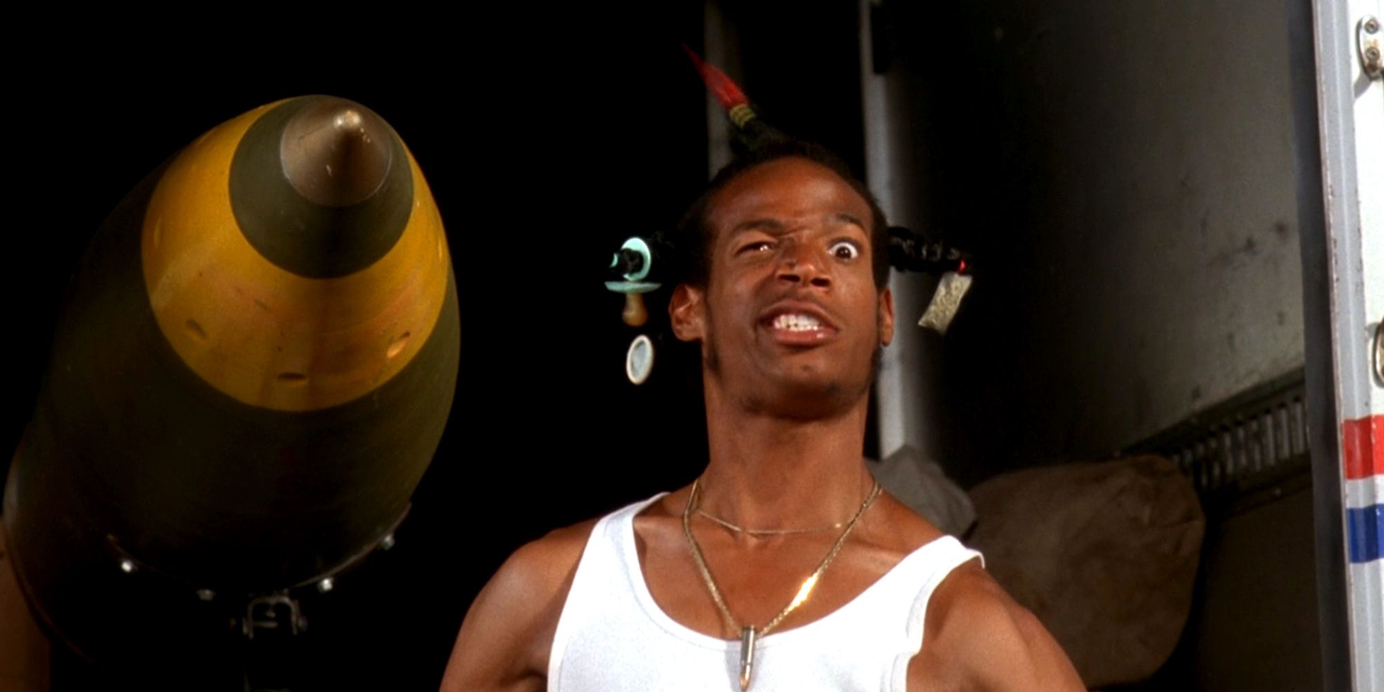 Marlon Wayans in a white tank top making a funny face in Don't Be A Menace