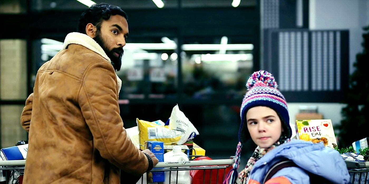 Jeevan, played by Himesh Patel, and Kirsten, played by Matilda Lawler, push carts full of groceries in Station Eleven