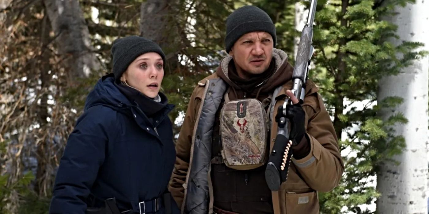 Elizabeth Olsen as Jane Banner and Jeremy Renner as Cory Lambert holding a gun, standing outdoors Wind River