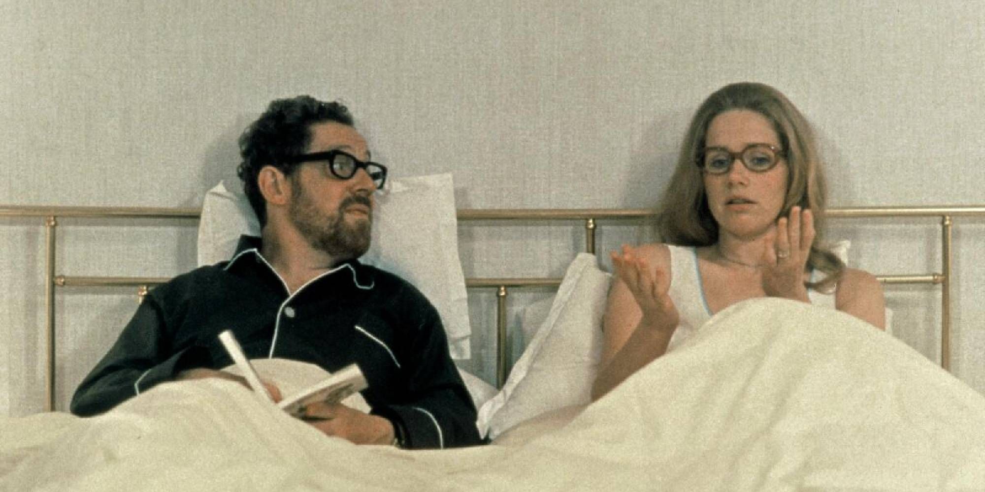 Erland Josephson and Liv Ullmann lying side by side in bed while having a conversation in Scenes From a Marriage