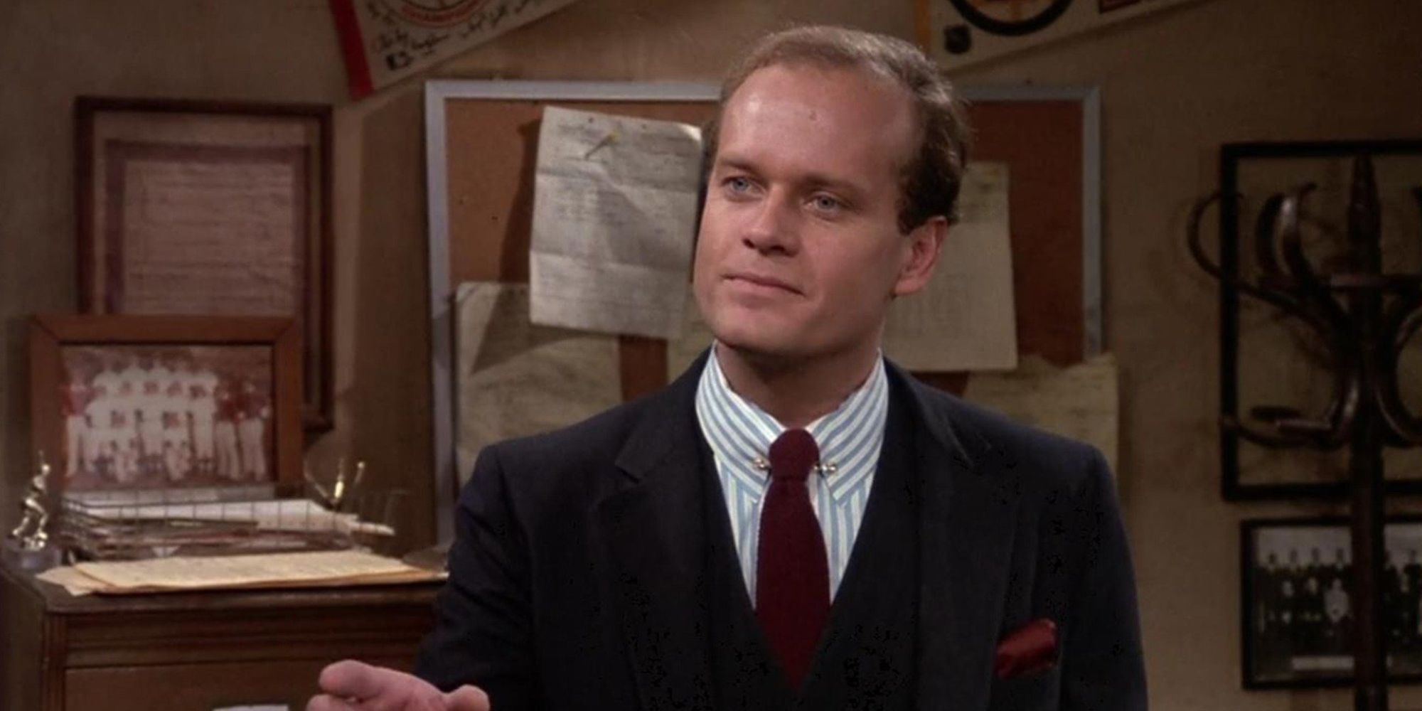 Frasier wears a suit in Sam's office in Cheers