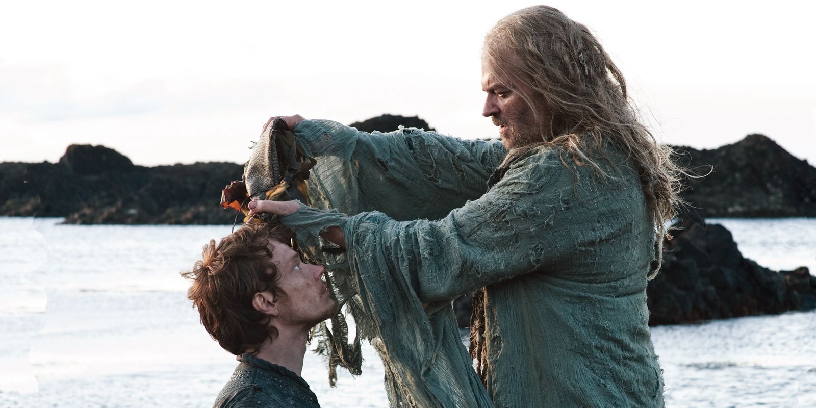 A priest performs a ceremony of Theon (Alfie Allen) in 'Game of Thrones'