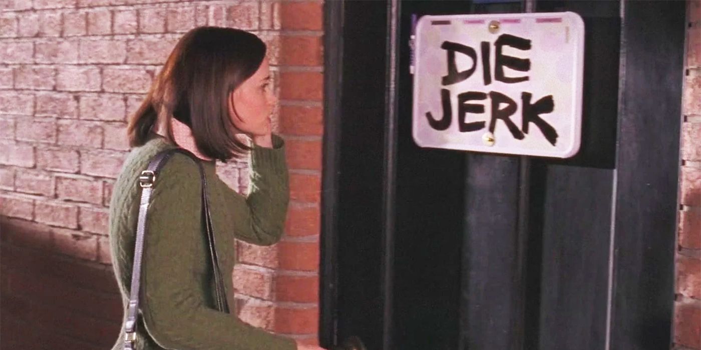 Alexis Bledel as Rory looking at a Die Jerk sign on her door in Gilmore Girls
