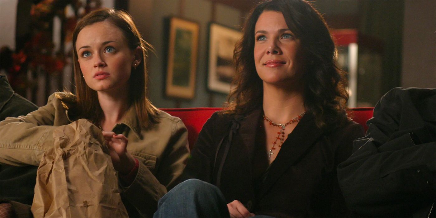 Alexis Bledel as Rory and Lauren Graham as Lorelai looking up from chairs in GIlmore Girls