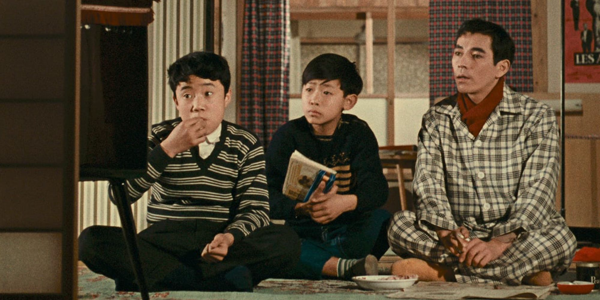 Three young boys sit in front of a TV in Good Morning 