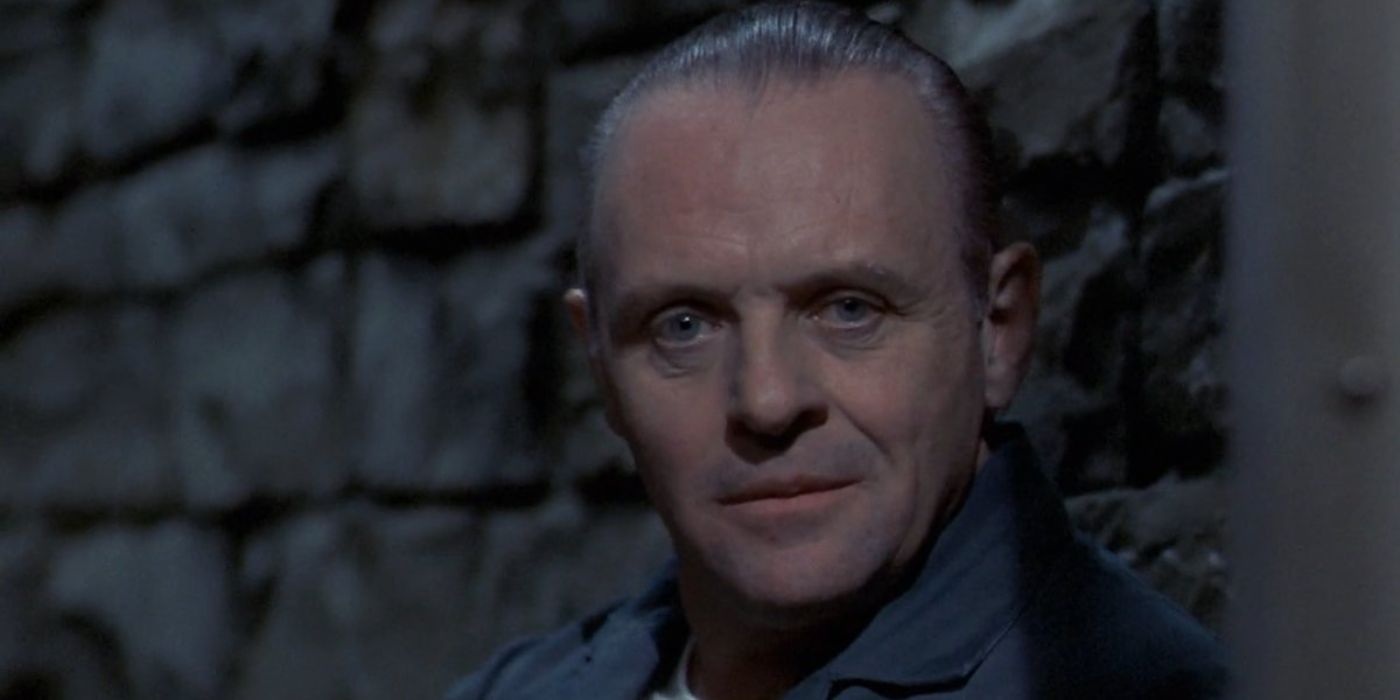 Hannibal smirks and looking intently ahead in The Silence of the Lambs